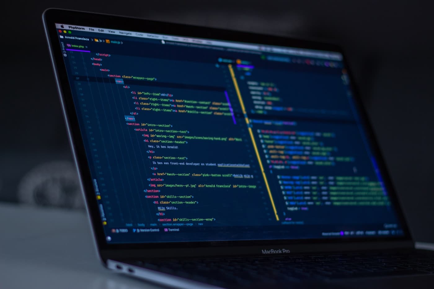 A screen of code in a dark workspace.